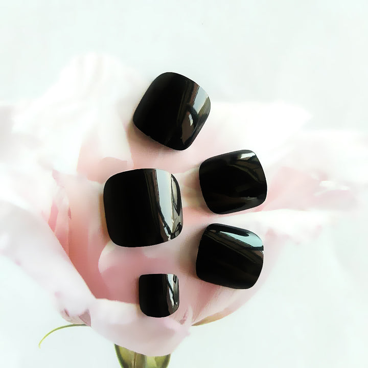 Glossy black toe nails