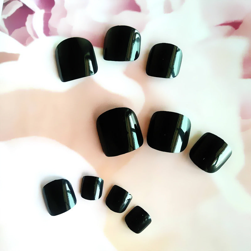 Glossy black toe nails
